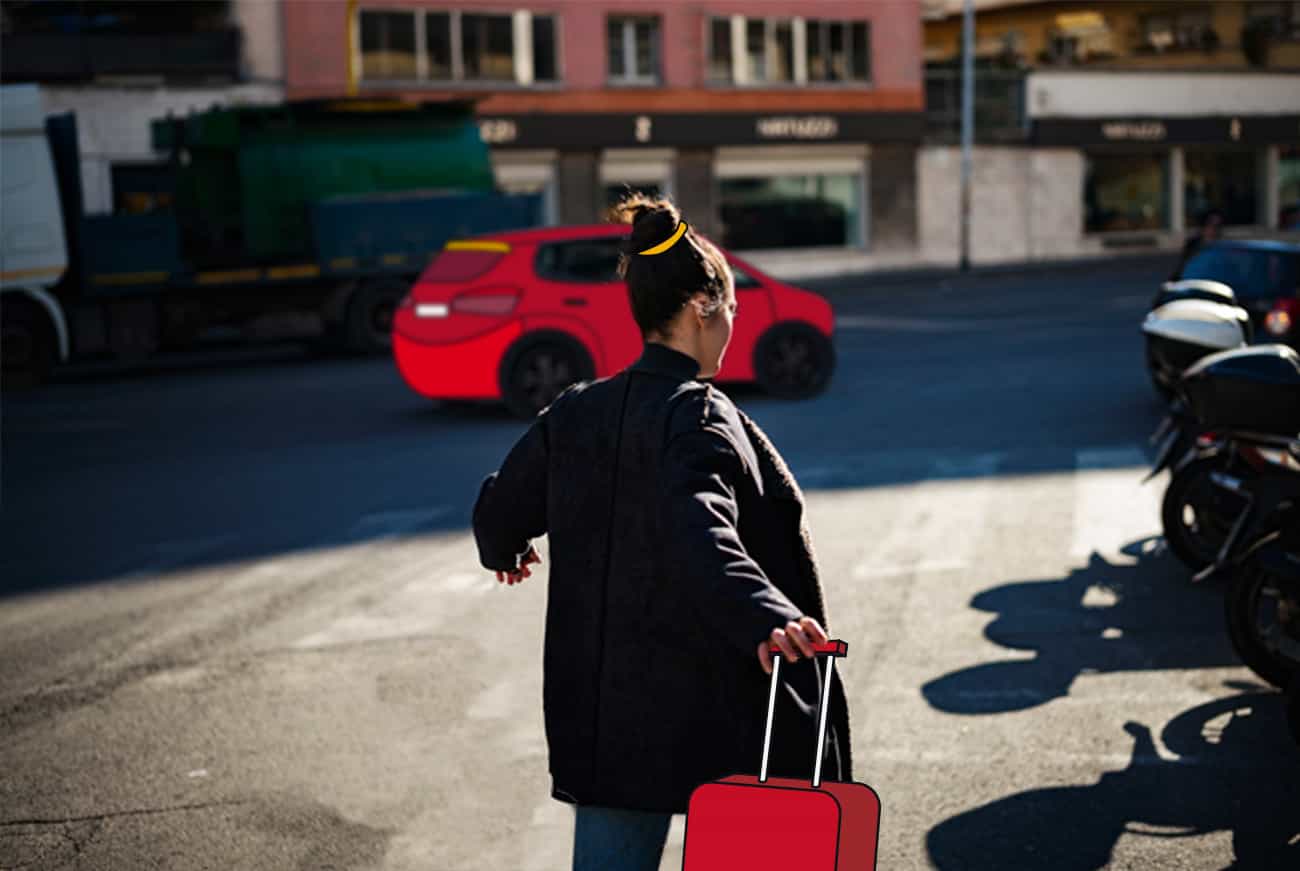 Employee on street with luggage rushing to red FREENOW taxi in background