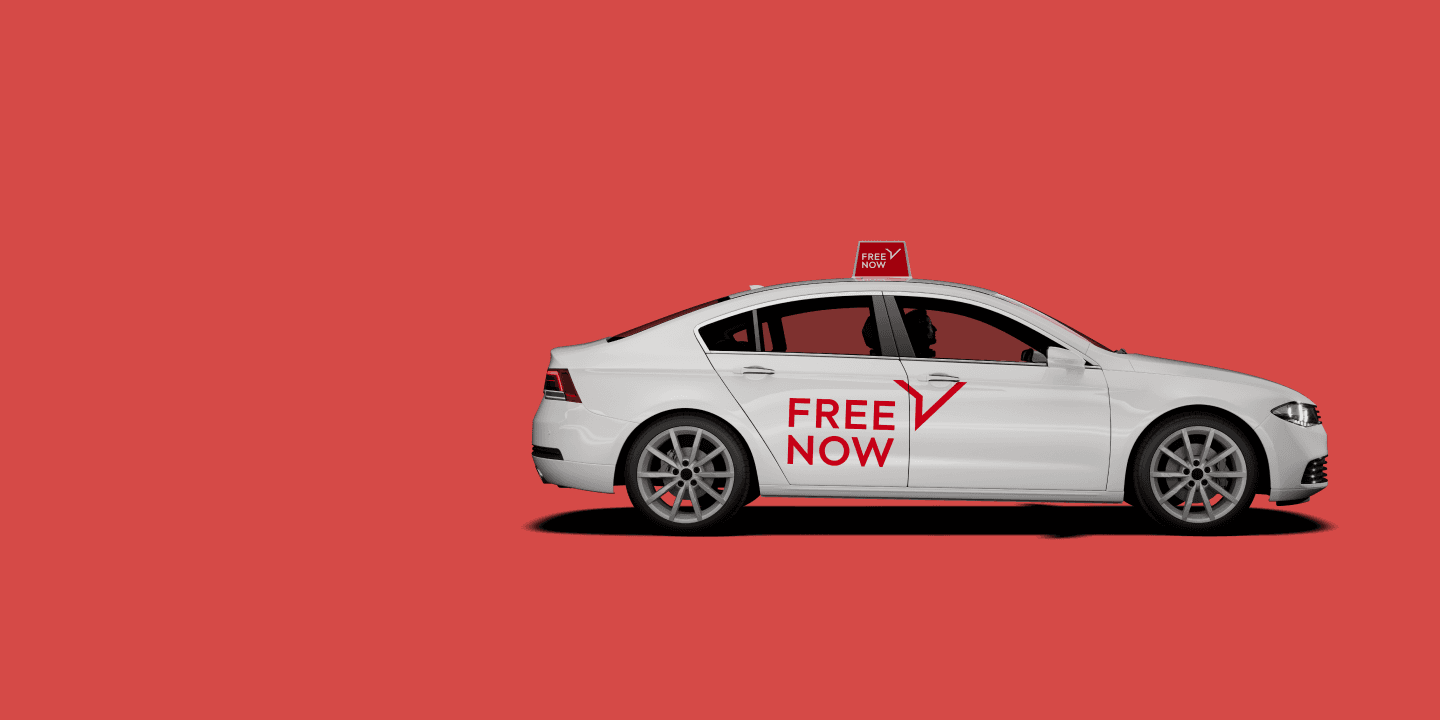 Taxi with FREENOW sticker on doors