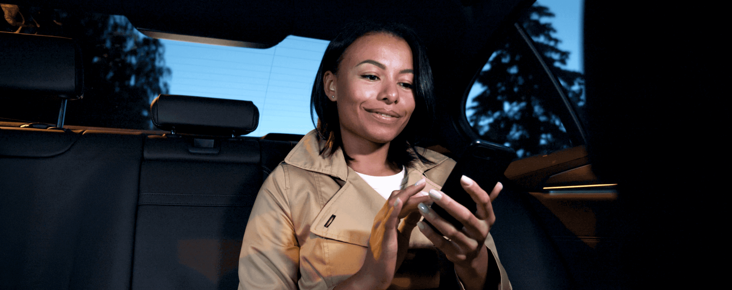 Two business travellers in a FREENOW taxi ride on a late night commute