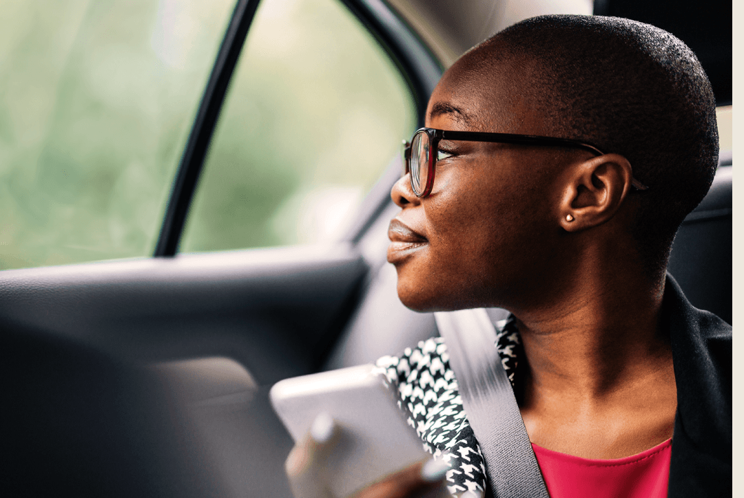 Employee enjoying time at a corporate event going to order FREENOW taxi soon