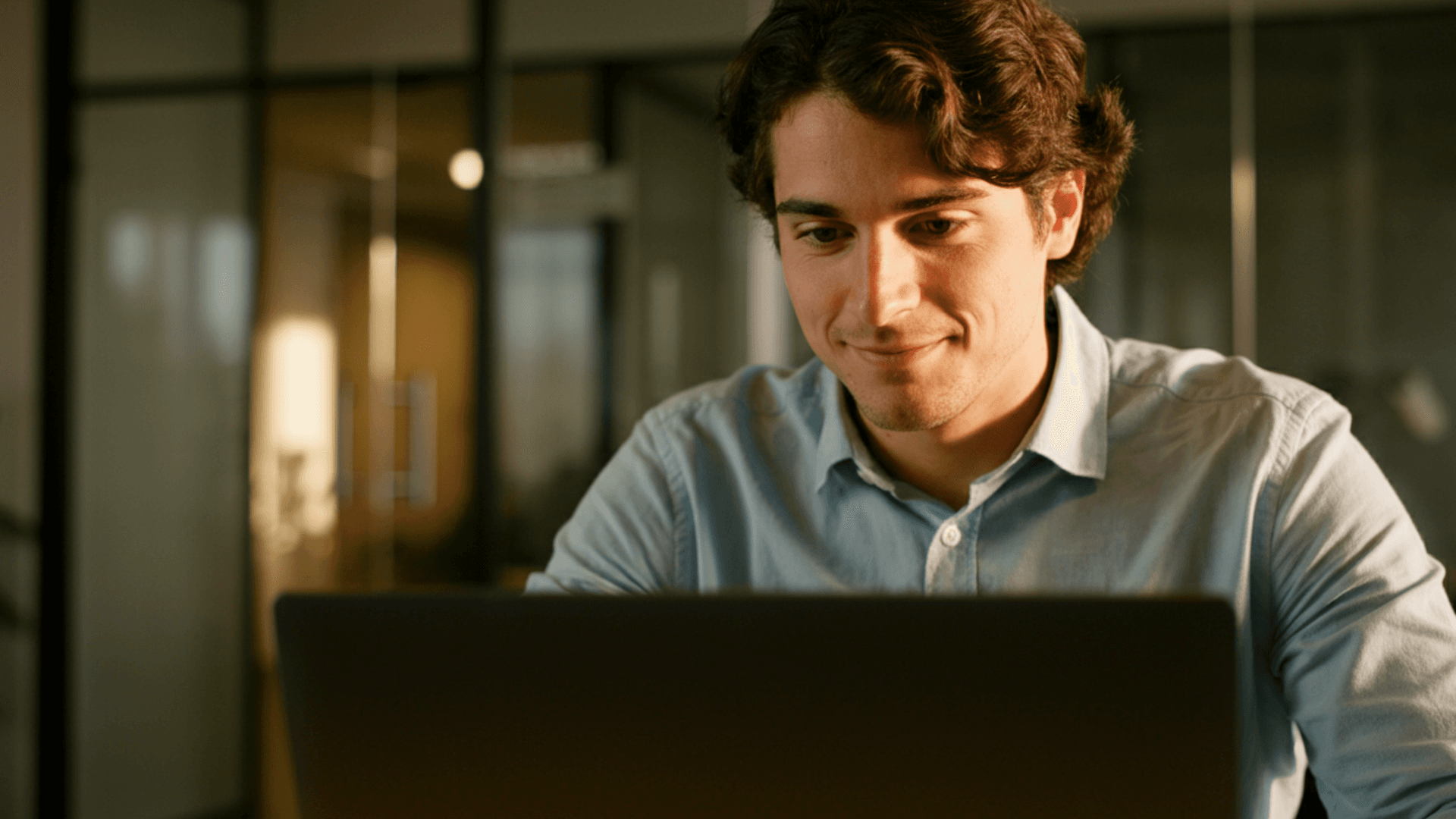 man looking at laptop
