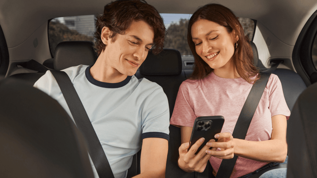 two passengers riding in taxi